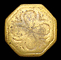 Octagonal copper alloy sleeve button with a clover-shaped decoration on its face.&nbsp;The shank break indicates that the link pulled through the loop with great force - click on image for larger view.